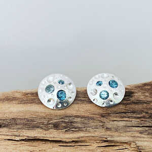 This is a picture of a pair of blue topaz earrings