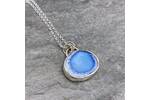 Turquoise and silver pendant.
