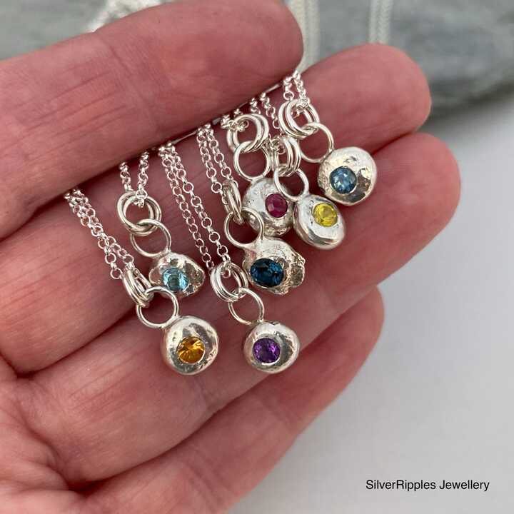 This is a picture of a silver nugget necklace