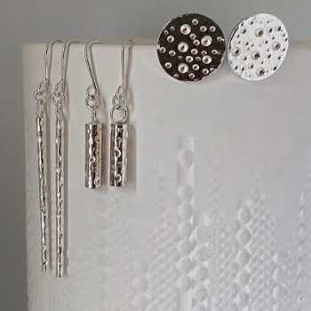 This is a picture of a bubbles patterned wide silver bangle