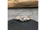 Silver bubbles ring set with a blue sapphire