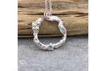Organic silver circle pendant with two blue Topaz stones. 3