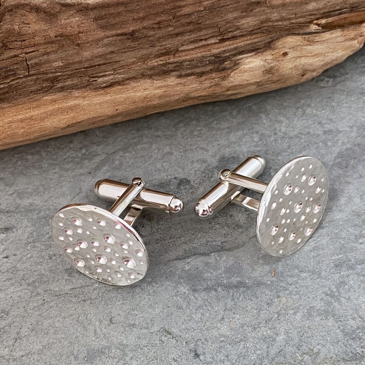 Round silver cufflinks