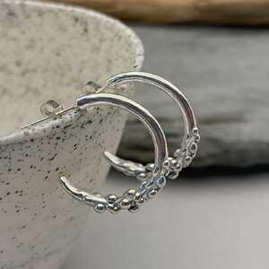 This is a picture of silver hoop earrings