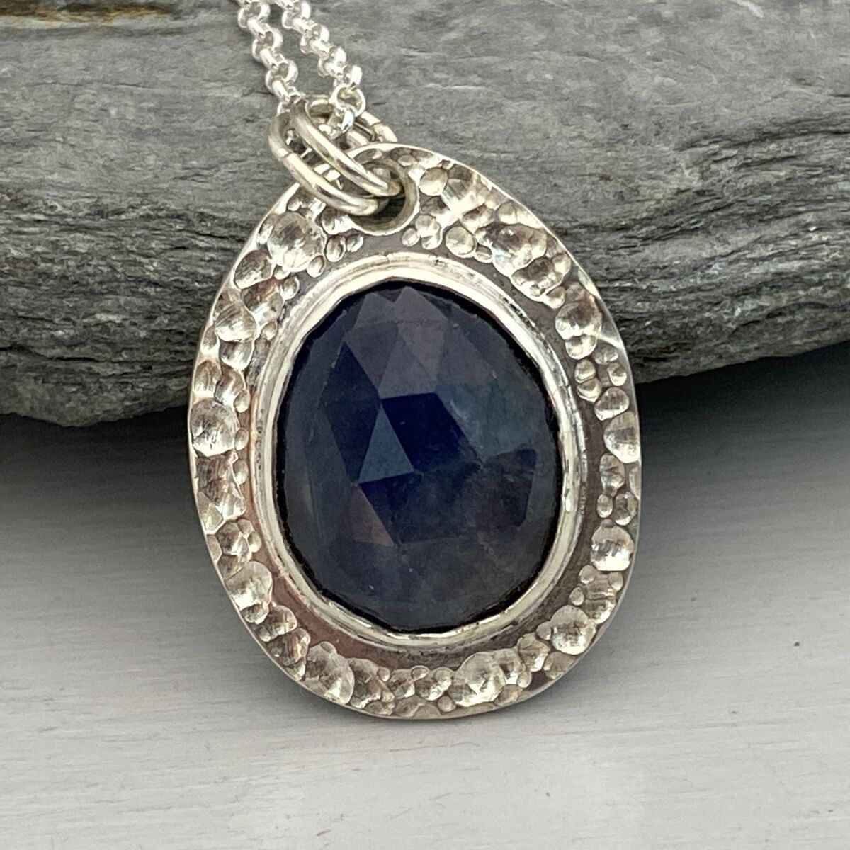 Dark blue sapphire pendant