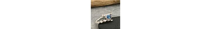 Twisted silver topaz ring