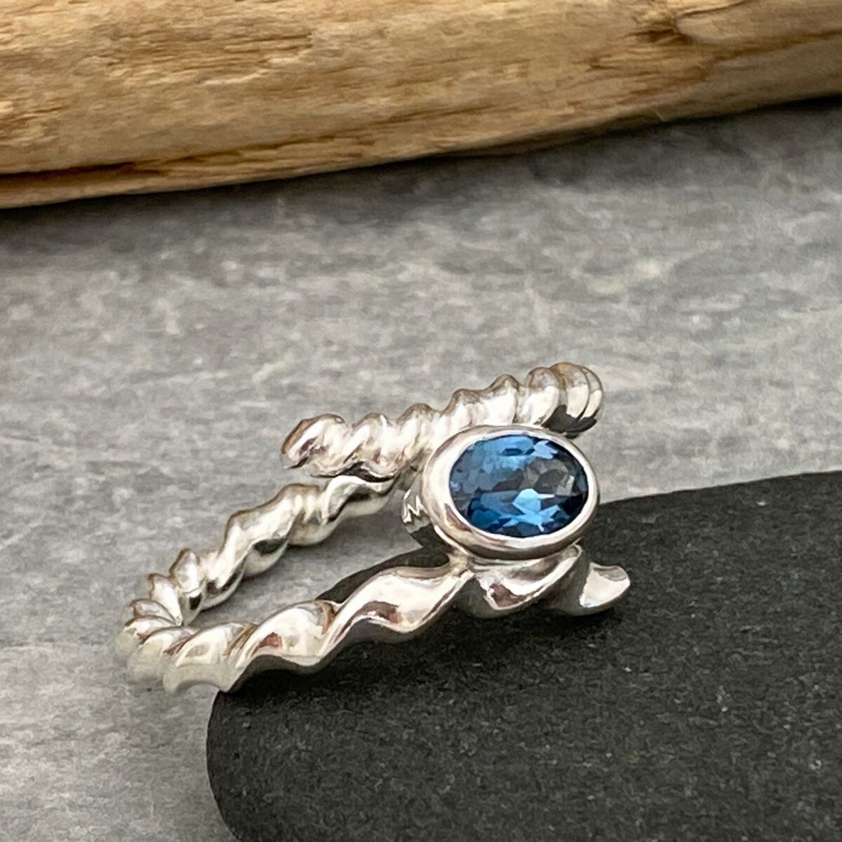 Twisted silver topaz ring