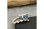 Twisted silver topaz ring