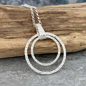This is a picture of a hammered silver circles pendant