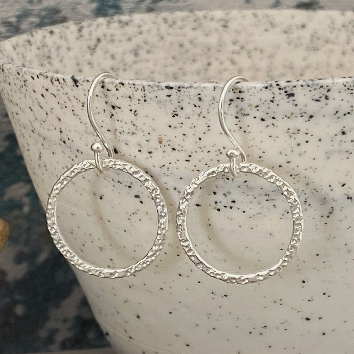 Round silver dangle earrings