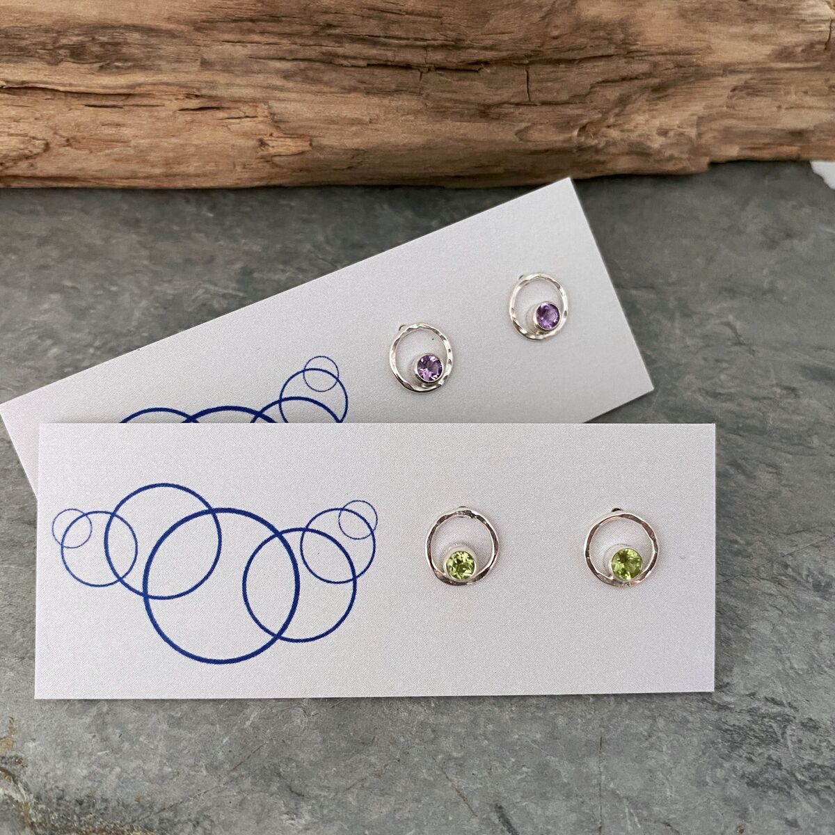 Small silver stud earrings with amethyst gemstone