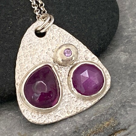 Pink sapphire and silver pendant