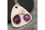 Pink sapphire and silver pendant