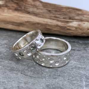 This is a picture of a pair of silver wedding rings This is a picture of a pair of silver wedding rings